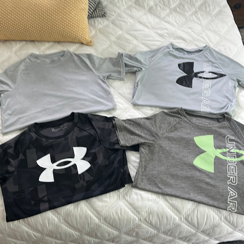 Lot of (4) size large Under Armour shirts in good condition.